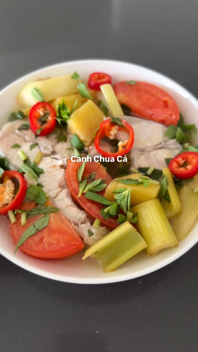 this + a bowl of rice = best thing ever. 🐟🍚

recipe 🔎 google “jenhdao Canh Chua Cá”

CANH CHUA CÁ (vietnamese sour soup)
Ingredients
	•	catfish
	•	chicken stock
	•	tomatoes + pineapple
	•	taro stems + celery
	•	bean sprouts (opt)
	•	tamarind seasoning
	•	fish sauce + sugar + salt
	•	chilies (opt)

Directions
	1. sauté tomatoes
	2. add stock, pineapple, tamarind → boil
	3. season
	4. add fish, simmer 6–8 min
	5. add veggies, cook briefly
	6. finish + serve hot with rice

#canhchua #vietnamesefood #vietfood #comfortfood #tamarindsoup