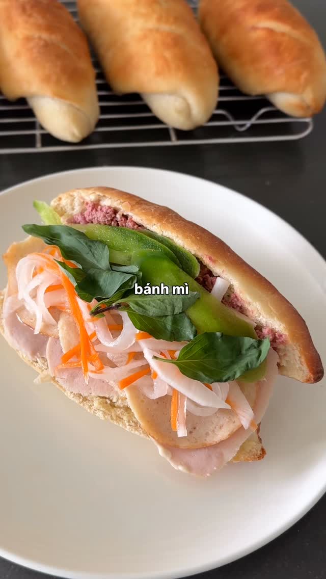 this is your sign to make bánh mì at home 🥖✨

recipe 🔎 google “jenhdao bánh mì”

🧾 BÁNH MÌ BREAD

Ingredients
 •  3 cups (375g) flour
 •  1 cup warm water
 •  2 tsp instant yeast
 •  2 tsp sugar
 •  1½ tsp salt
 •  1 tbsp oil

Directions
  1  Mix everything → form dough
  2  Knead 5–6 min until smooth
  3  Rise 1 hr (until doubled)
 4  Divide into 6, shape into logs
  5  Rest 30–40 min
  6  Bake at 425°F with steam (add hot water pan)
 7  Score + bake 14–16 min until golden
cool slightly → slice → enjoy 🥖

#banhmi #vietnamesefood #homemadebread #breadrecipe #vietfood